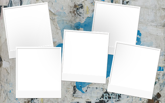 Blank Polaroid Frames On Weathered Background