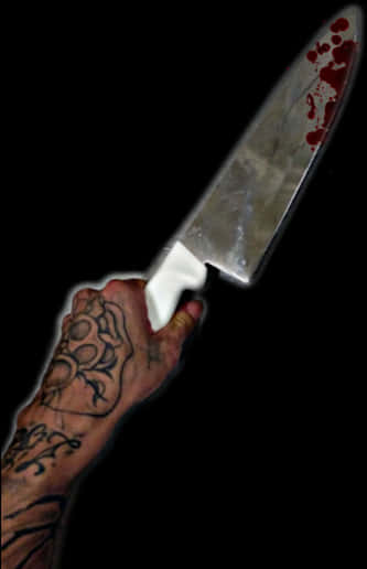 Bloodstained Knifein Tattooed Hand.jpg