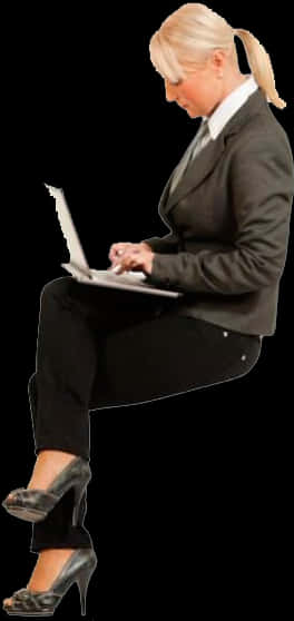 Businesswoman Using Laptop While Sitting