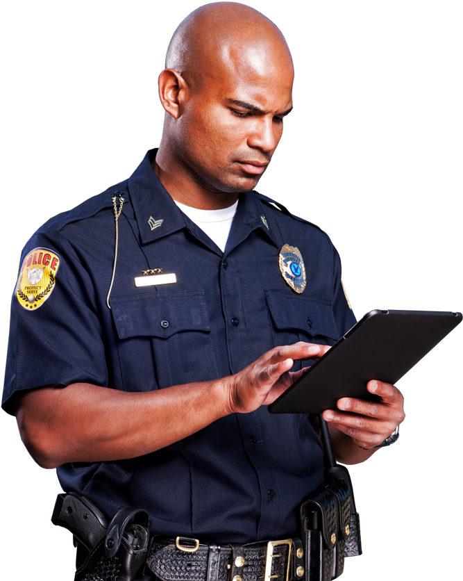 Focused Police Officer Using Tablet