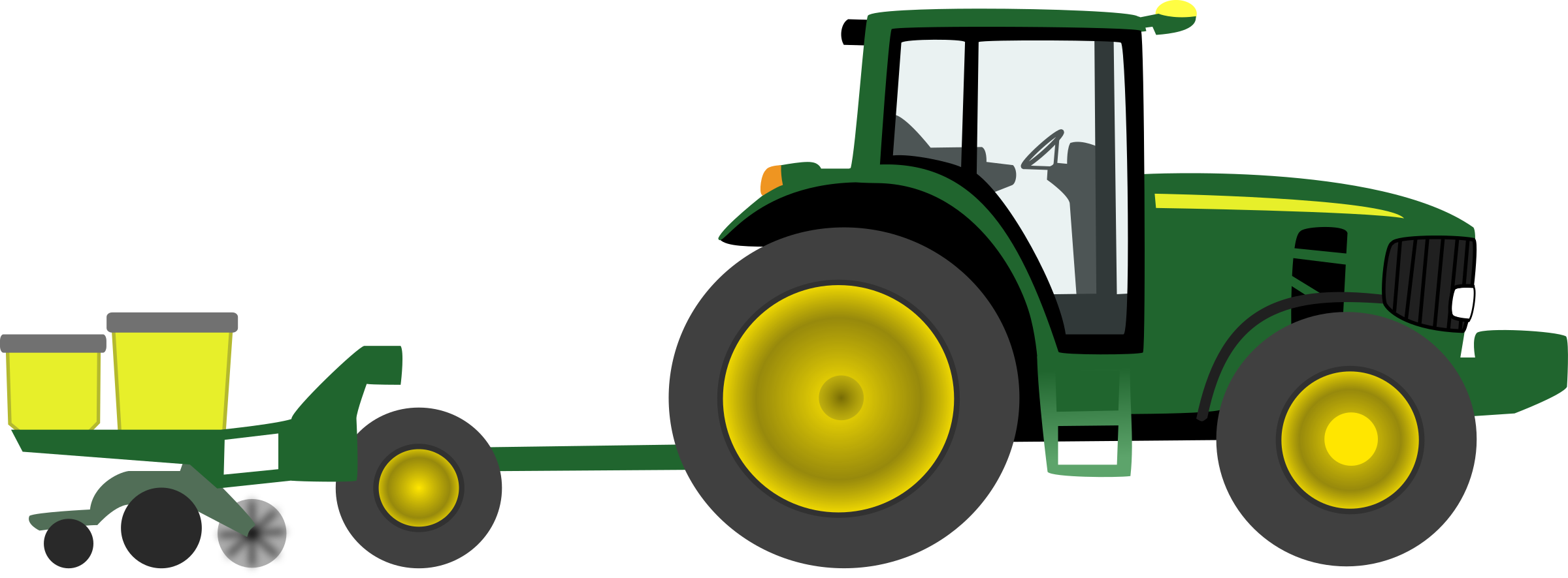 Green Tractor With Seeder Attachment