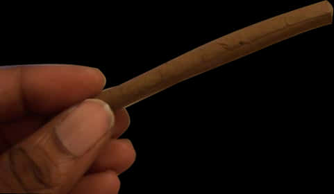 Hand Holding Rolled Blunt