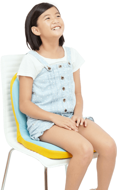 Happy Young Girl Sittingin Colorful Chair
