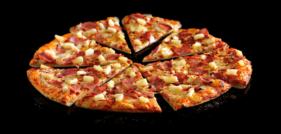 Hawaiian Pizza Sliced Black Background