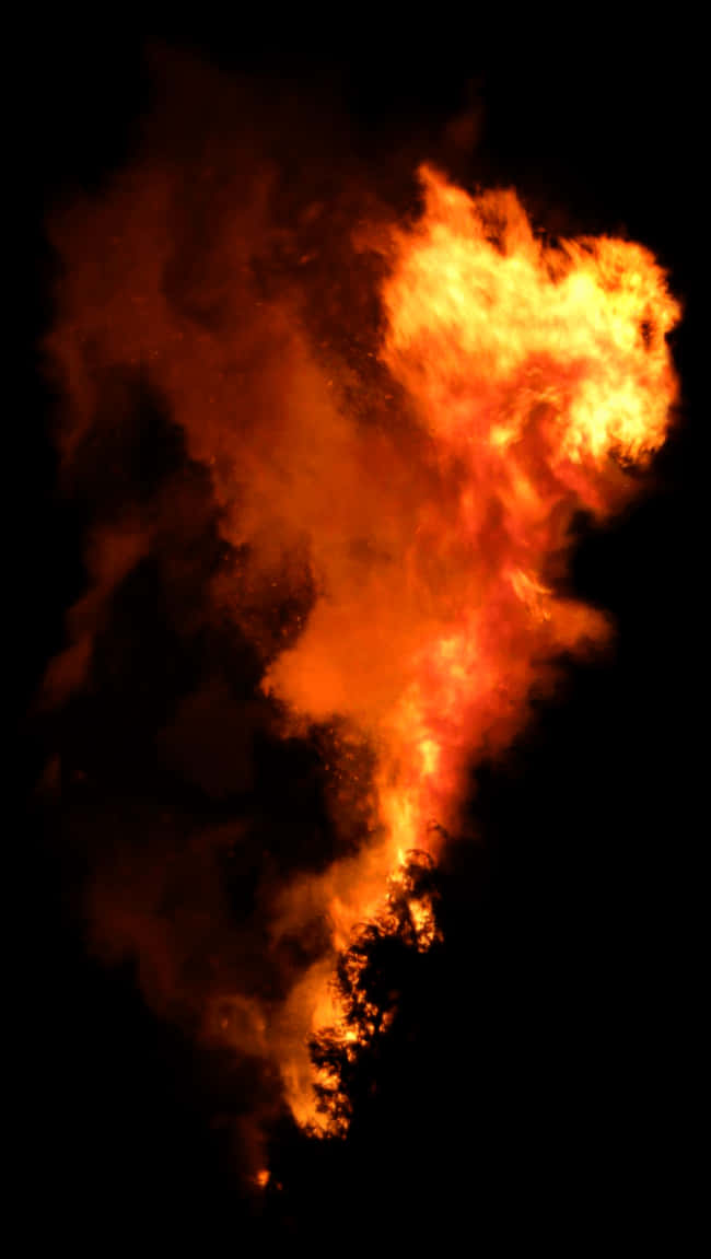 Intense_ Fire_and_ Smoke_ Against_ Night_ Sky