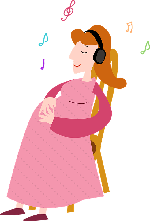 Pregnant Woman Listeningto Music