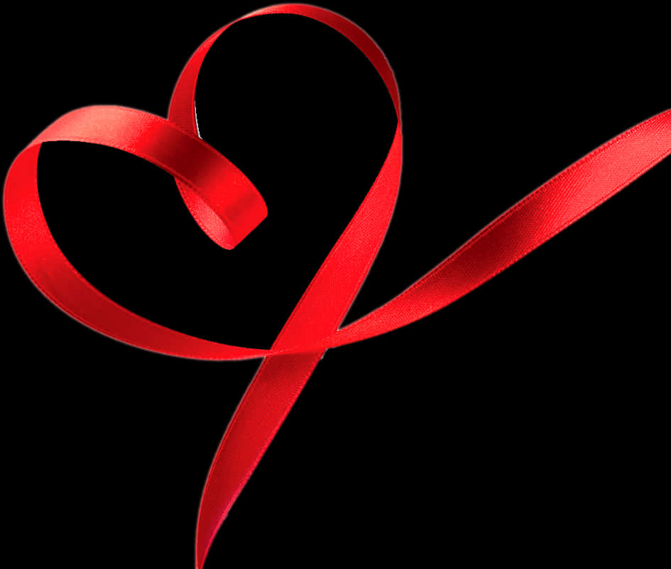 Red Ribbon Heart Shaped Against Black Background