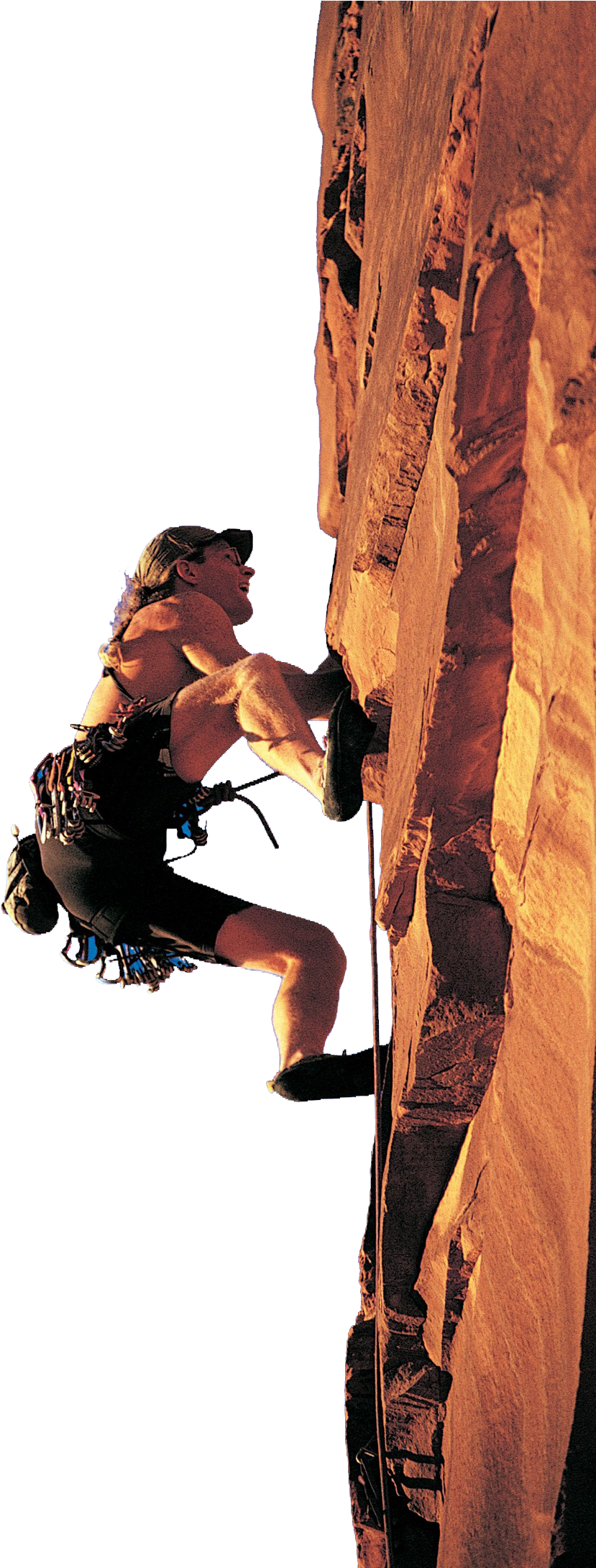 Rock Climber Ascending Cliff