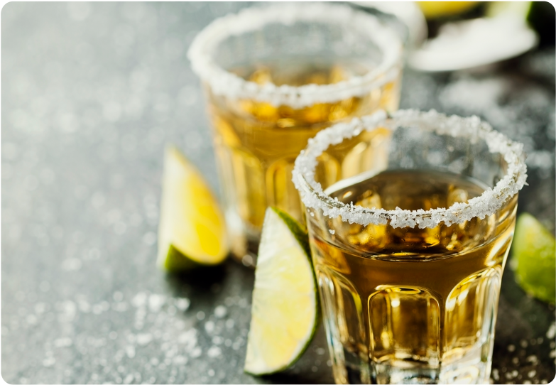 Salt Rimmed Tequila Shots With Lime Wedges