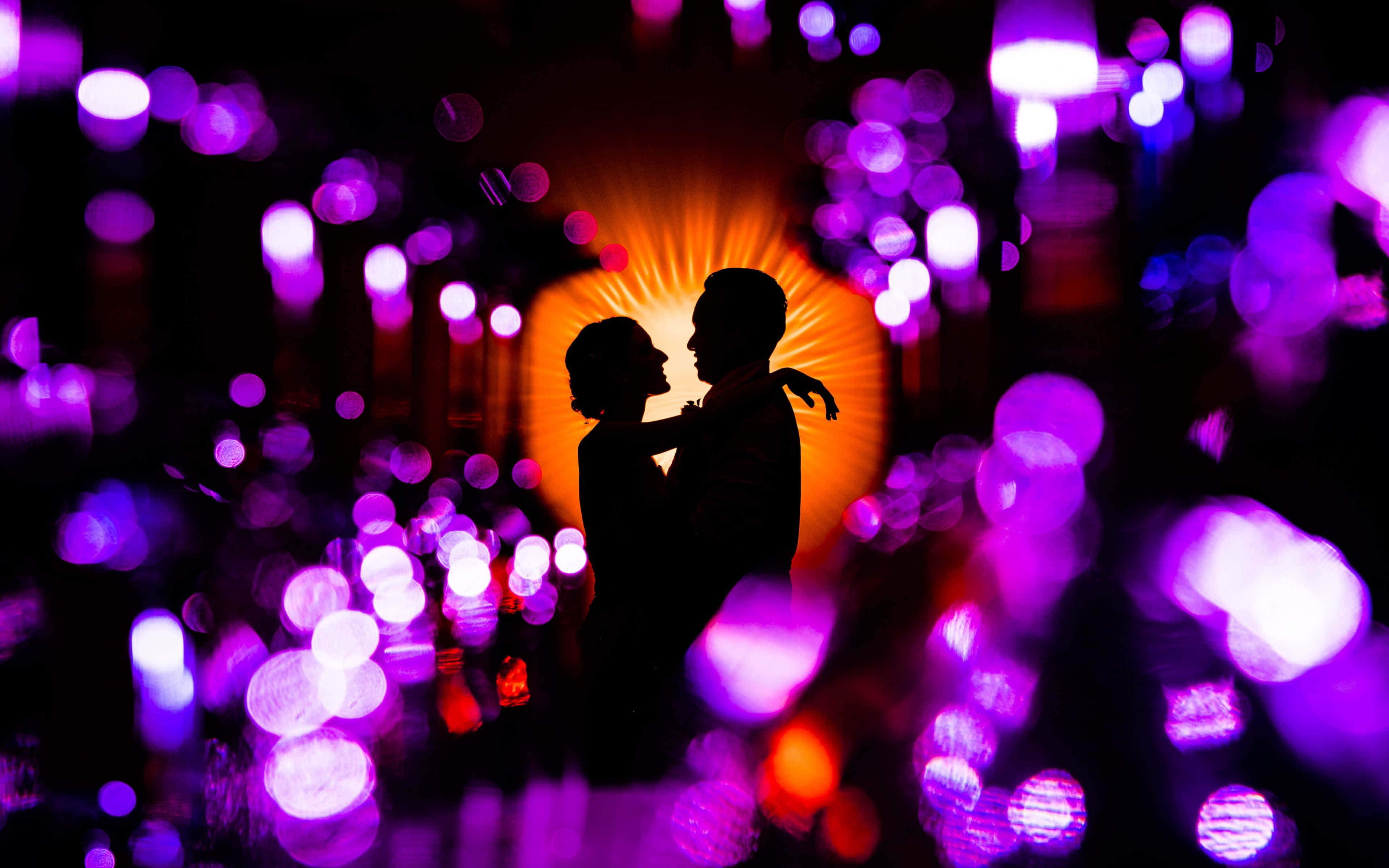 Silhouette Love Amidst Shimmering Lights