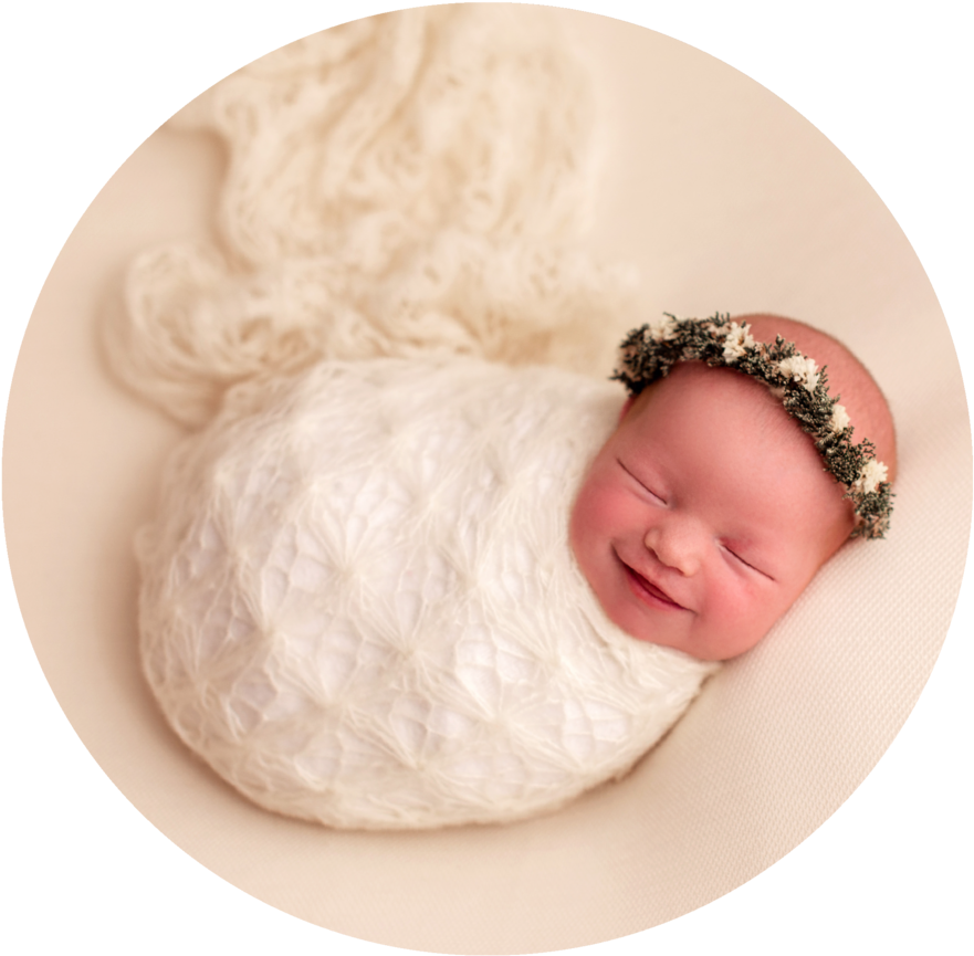 Sleeping Newborn Wrappedin White Blanket