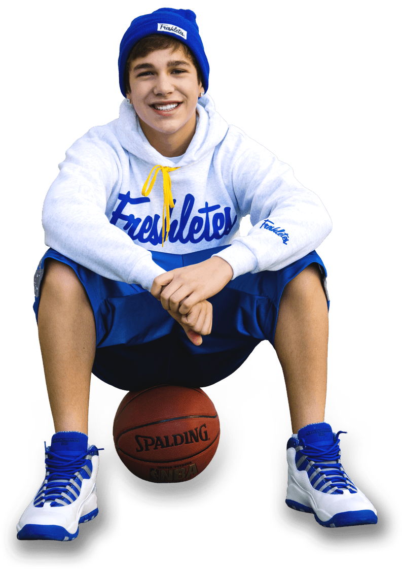 Smiling Teen Basketball Player Sitting