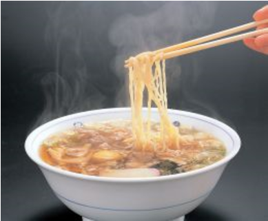 Steaming Ramen Noodles Lifted With Chopsticks