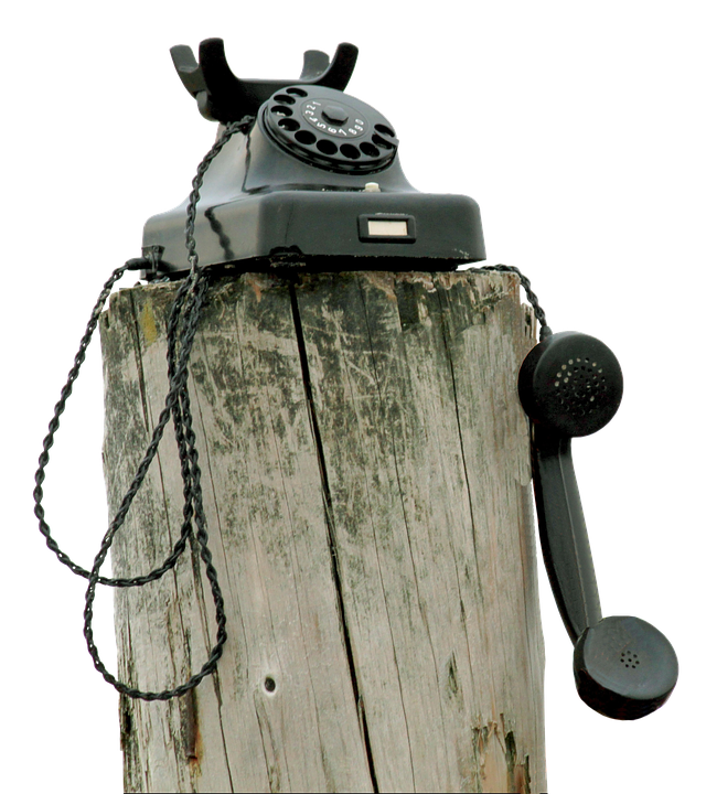 Vintage Telephoneon Wooden Post