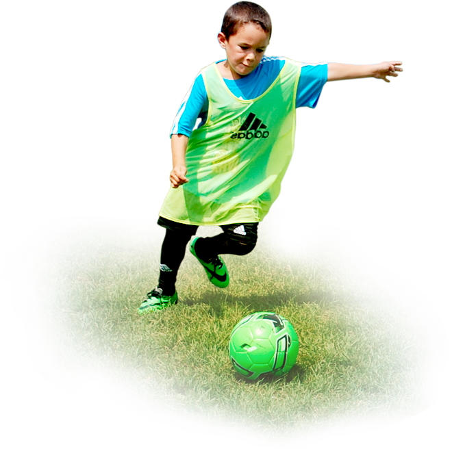 Young Player Kicking Soccer Ball