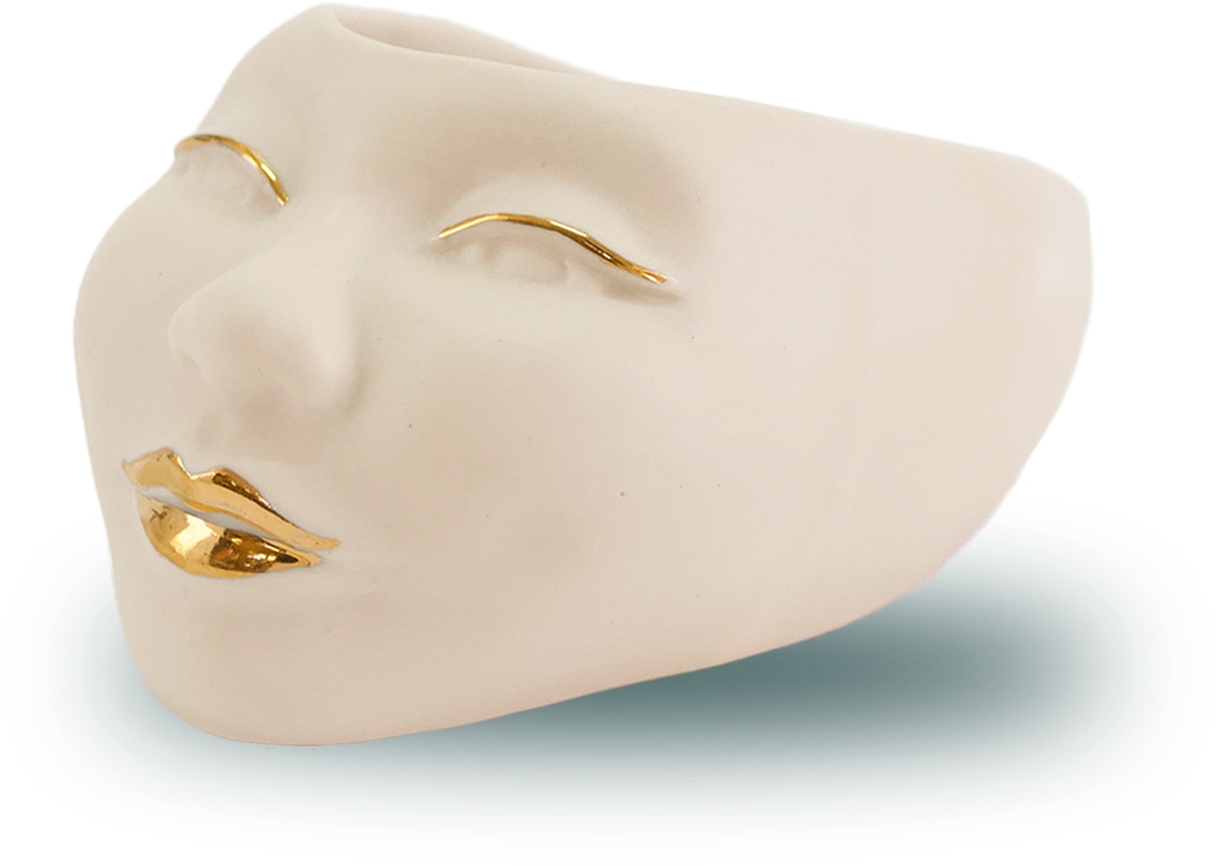 Abstract Face Planterwith Gold Features PNG image