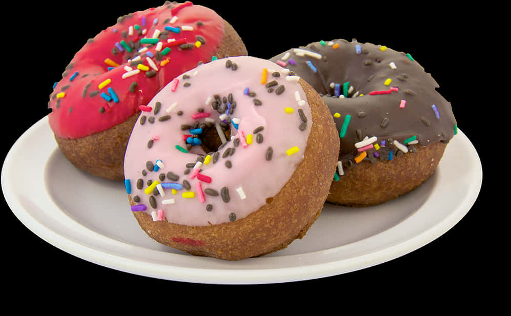 Assorted Frosted Donutson Plate PNG image