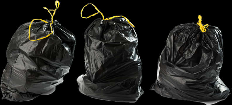 Black Garbage Bagswith Yellow Ties PNG image