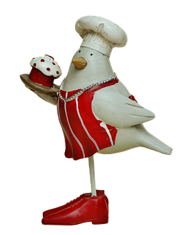 Chef Bird Figurinewith Cupcake PNG image