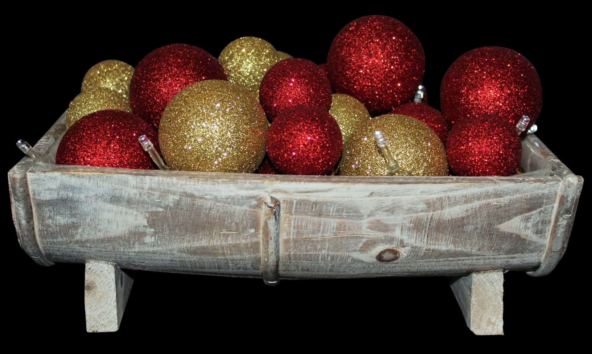 Christmas Sparkle Ornamentsin Wooden Trough PNG image