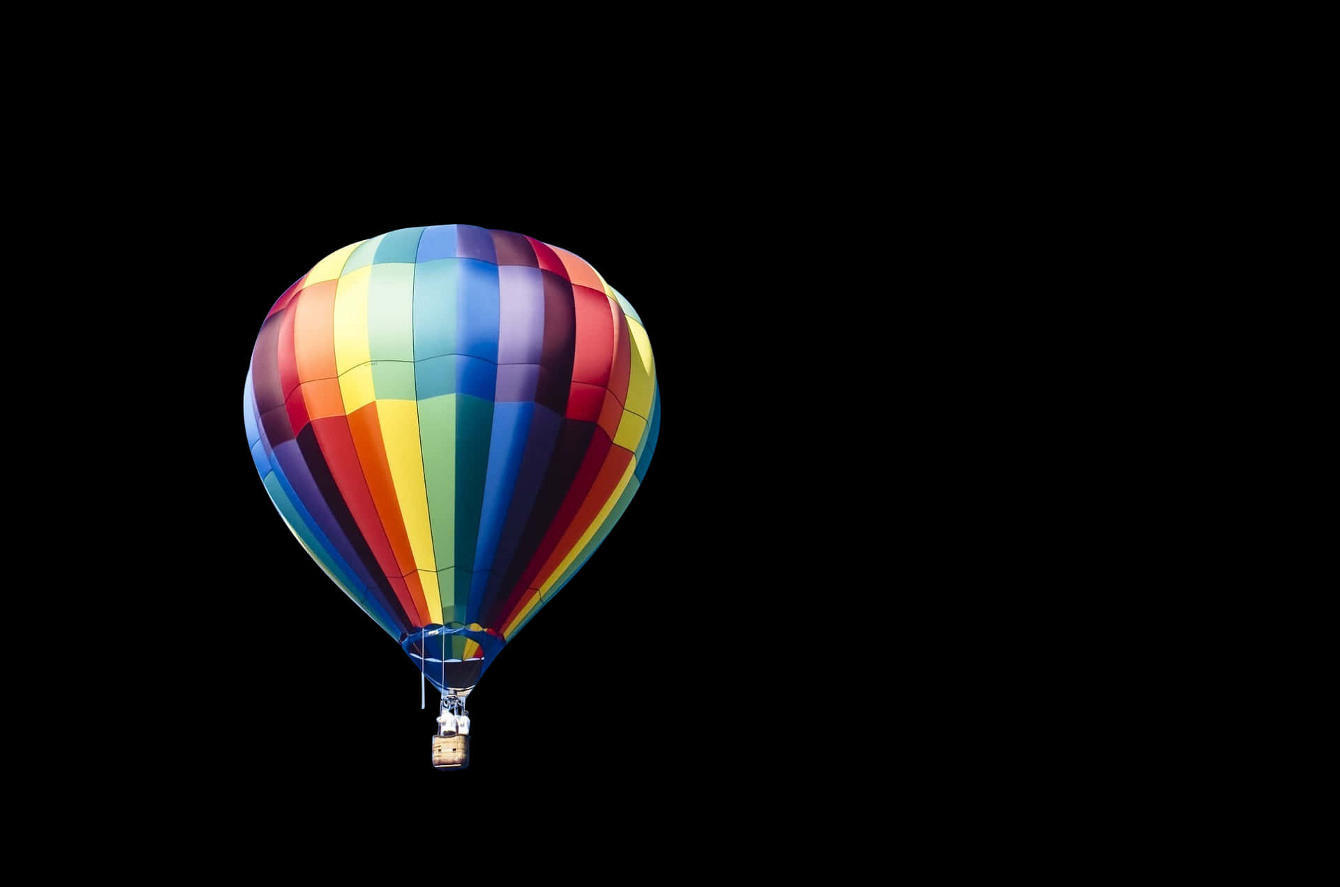 Colorful Hot Air Balloon Against Black Background PNG image