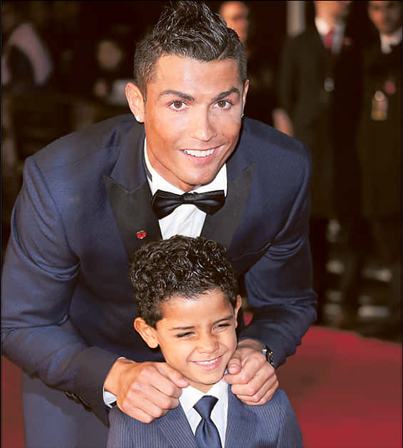 Cristiano Ronaldo Smiling With Child At Event PNG image