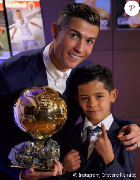 Cristiano Ronaldowith Golden Balland Child PNG image