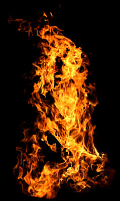 Dancing Flames Against Darkness PNG image