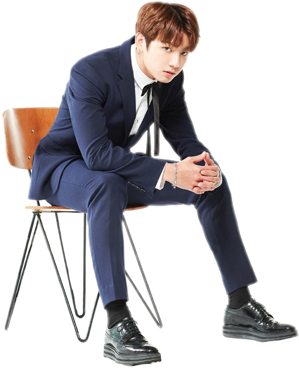 Elegant Man Seatedin Blue Suit PNG image