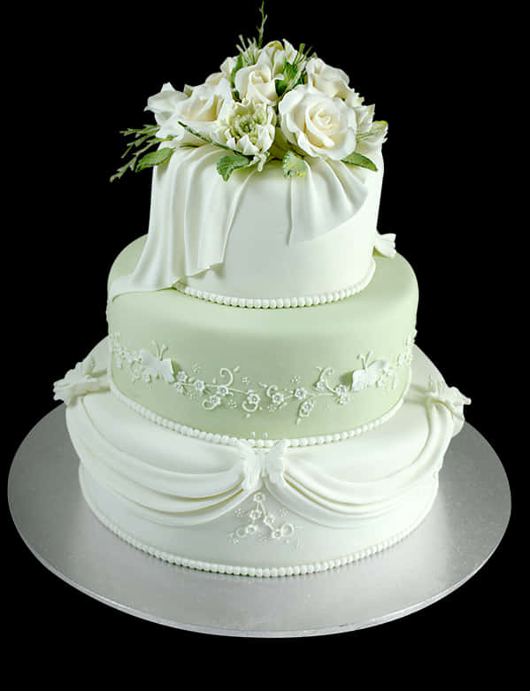 Elegant Three Tier Wedding Cakewith Floral Topper PNG image