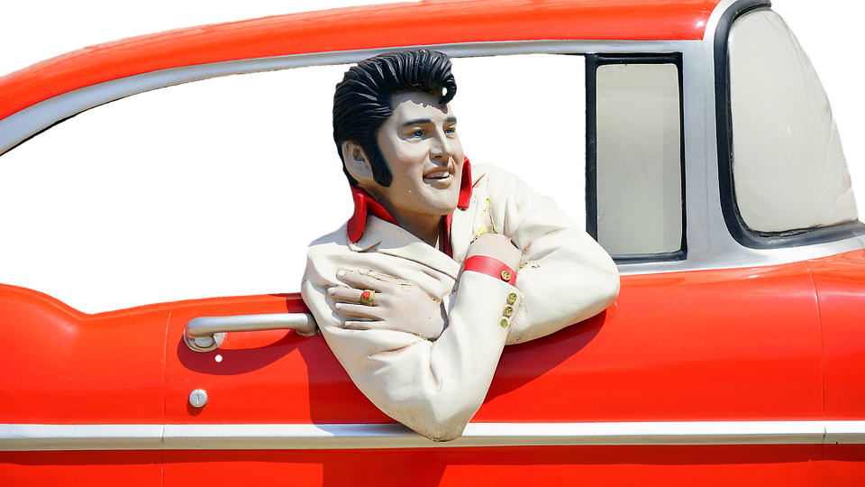 Elvis Presley Figurein Classic Car PNG image