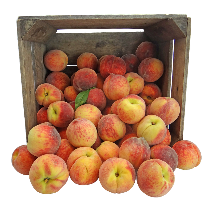 Fresh Peachesin Wooden Crate PNG image