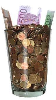 Glass Jar Fullof Coinsand Banknotes PNG image