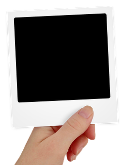 Hand Holding Blank Polaroid Frame PNG image