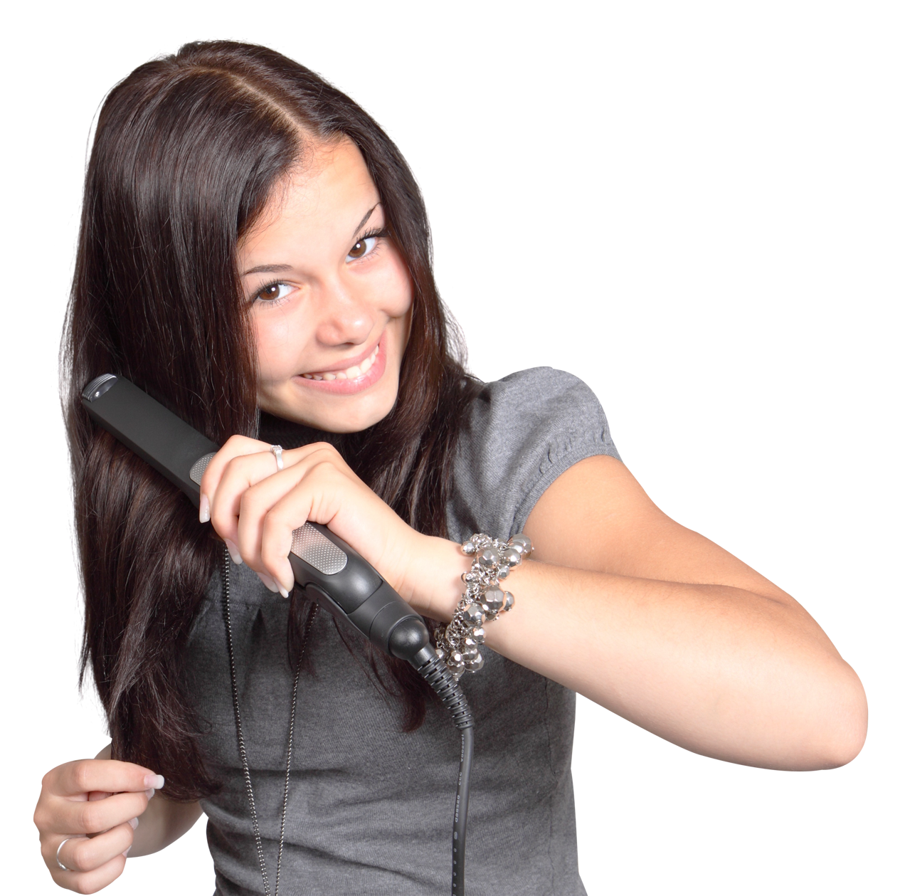 Happy Teen Girl Styling Hairwith Flat Iron PNG image