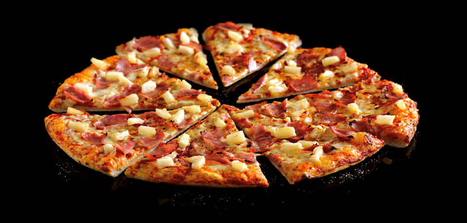 Hawaiian Pizza Sliced Black Background PNG image