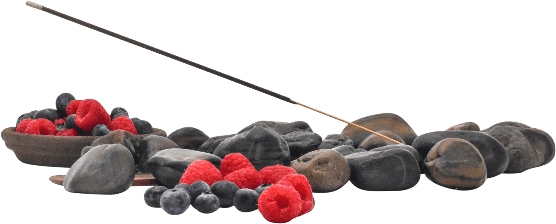 Incense Stick Above Stonesand Berries PNG image