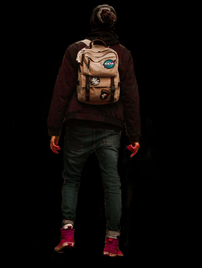 Man With Backpack Standing Against Black Background PNG image