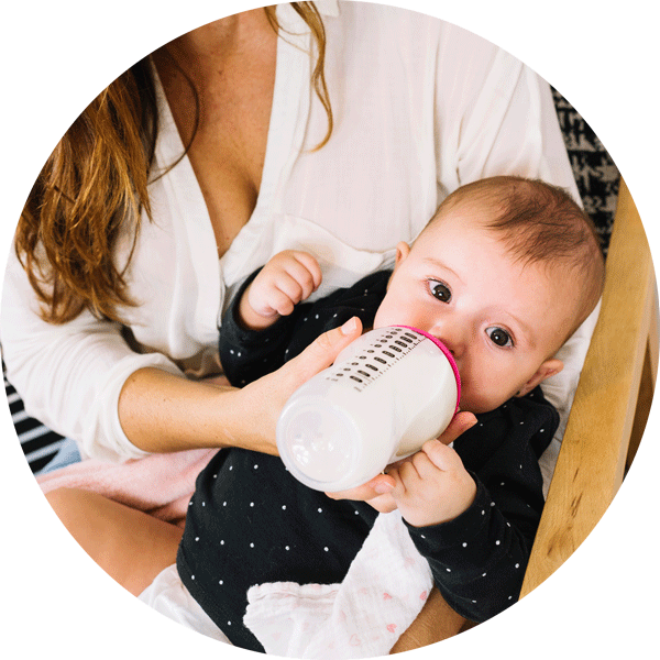 Mother Feeding Baby With Bottle PNG image
