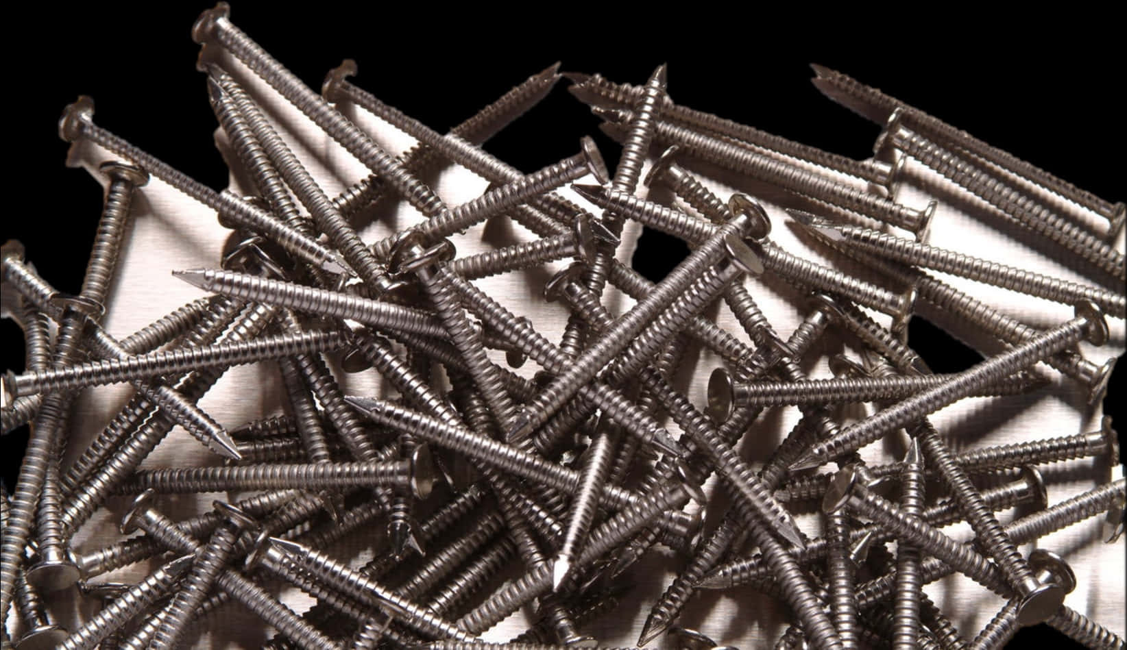 Pileof Screwson Black Background PNG image