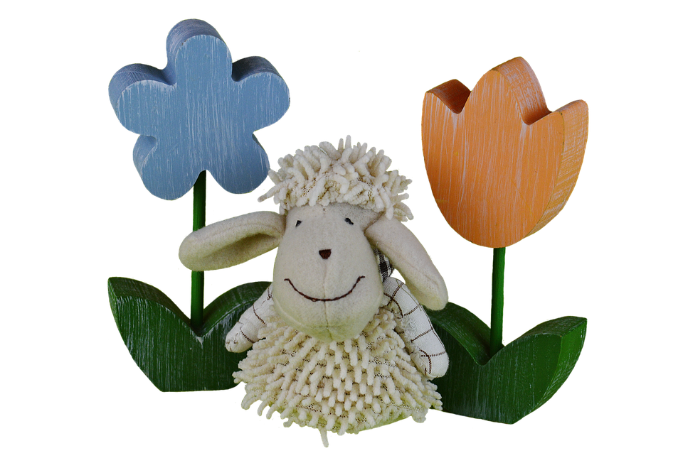 Smiling Sheep Between Wooden Flowers PNG image