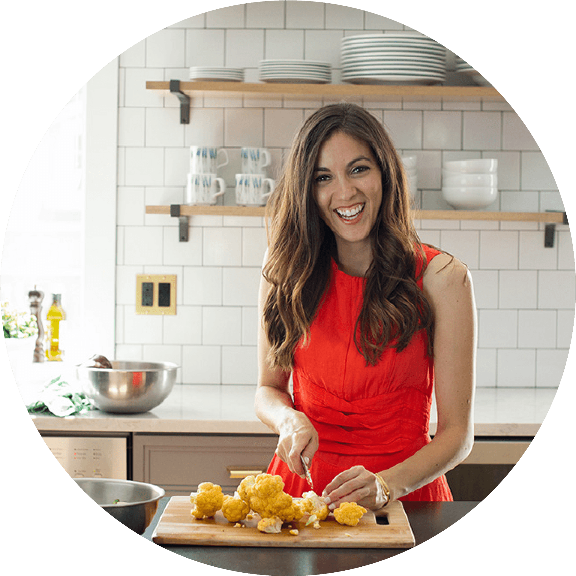 Smiling Woman Cookingin Kitchen PNG image