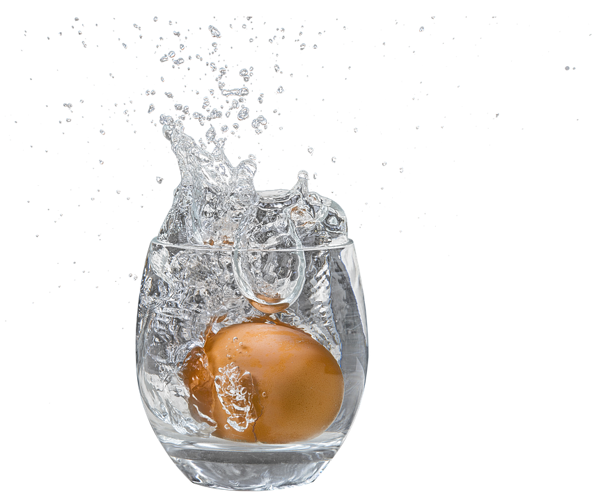 Splashy Egg Dropin Water Glass PNG image
