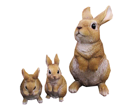 Three Rabbit Figurines Black Background PNG image