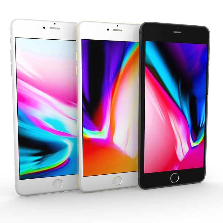 Threei Phone Models Displaying Colorful Wallpapers PNG image