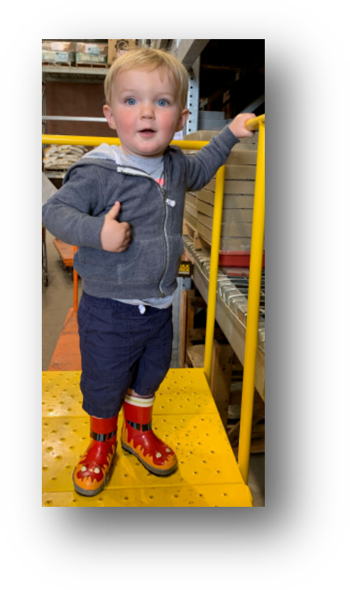 Toddler In Warehouse With Boots PNG image