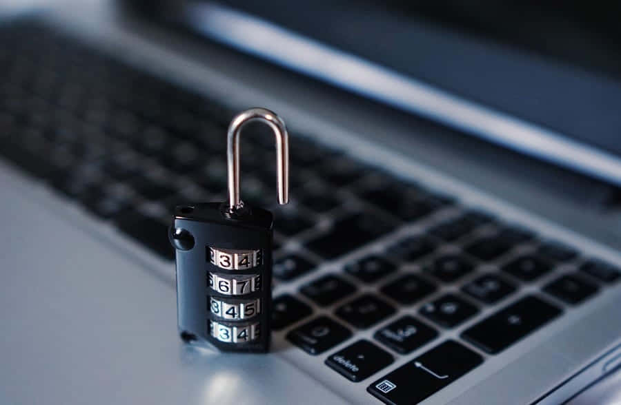 Unlocked Padlockon Laptop Keyboard PNG image