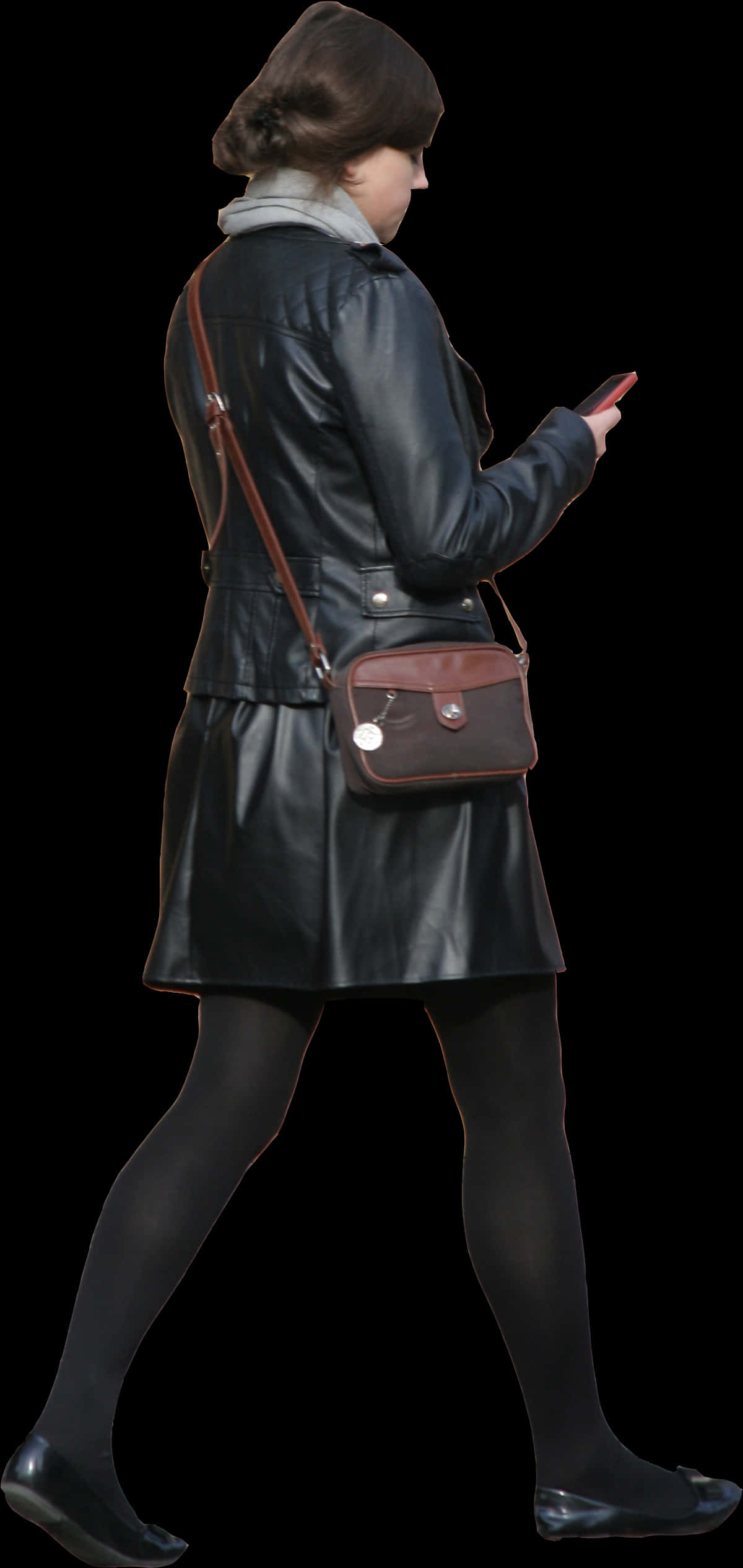 Womanin Leather Coat Walkingand Texting PNG image