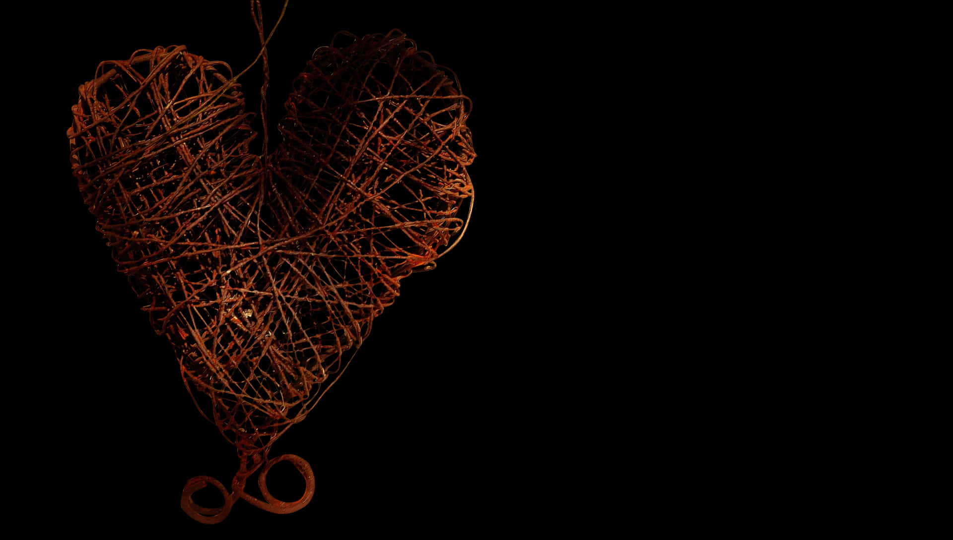 Woven Heart Sculptureon Black Background PNG image