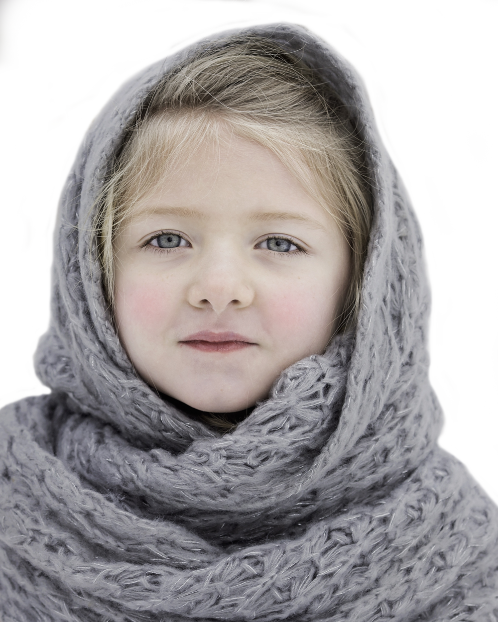 Young Girl Wrappedin Knit Scarf PNG image